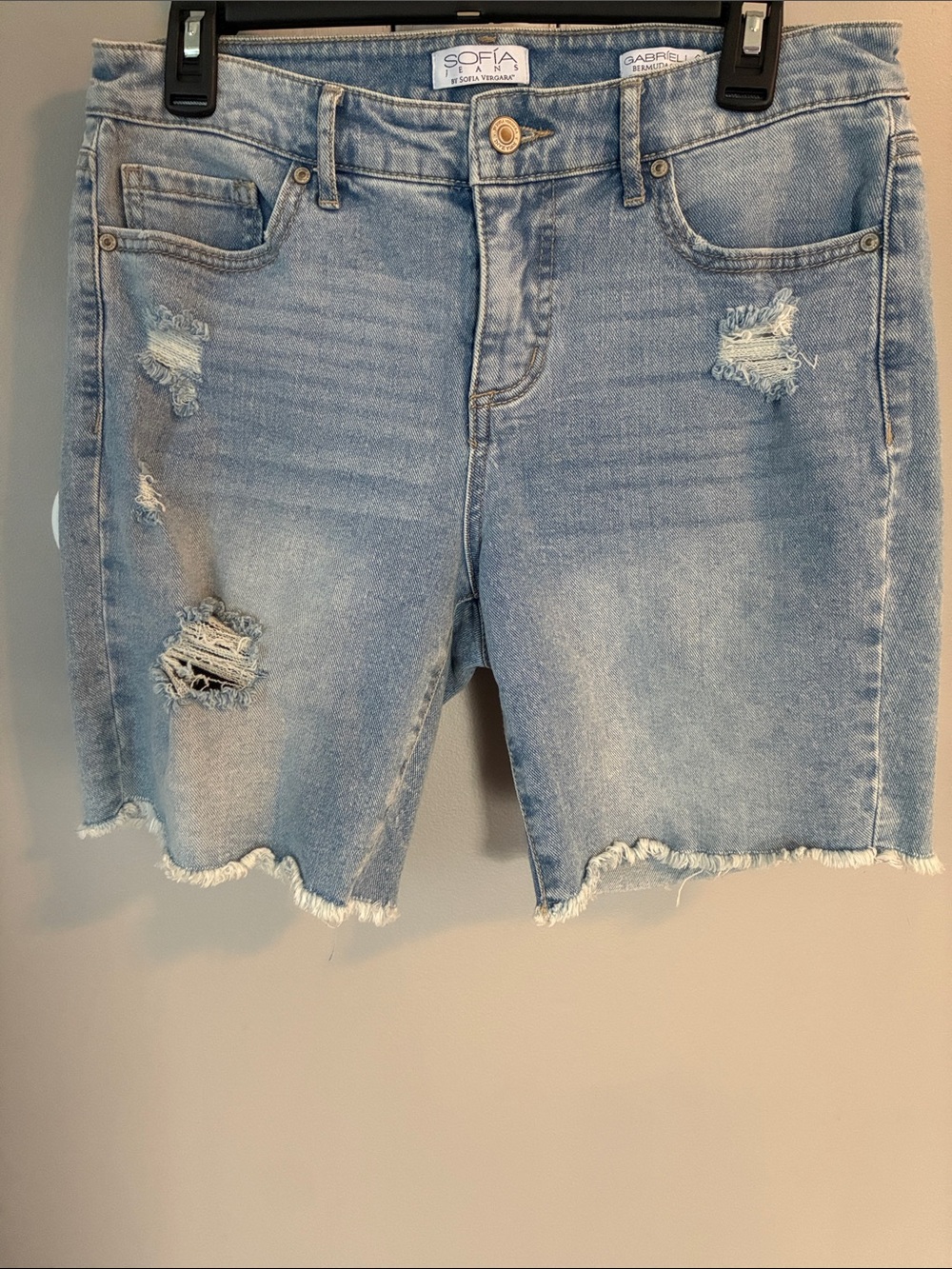 Women’s light wash high rise distressed frayed edge jean Bermuda shorts